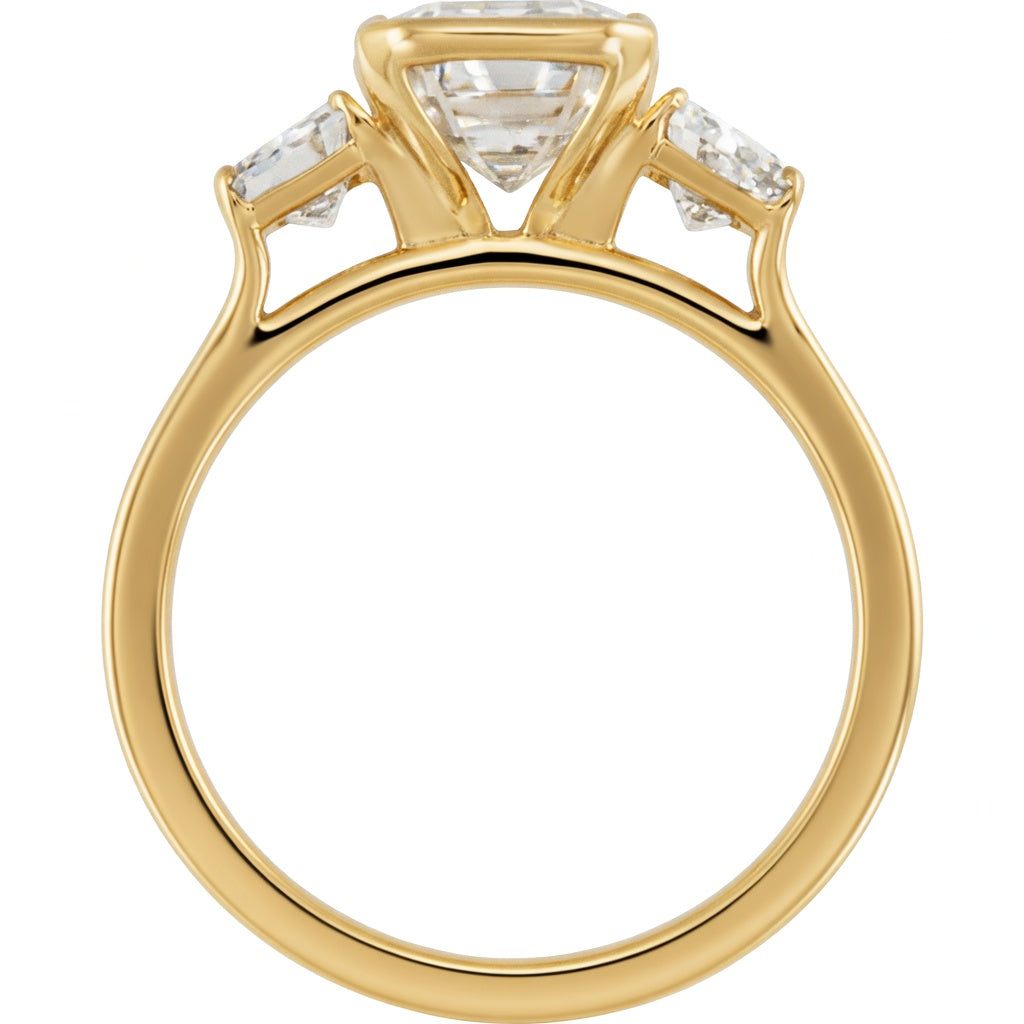 2.5 carat emerald cut lab grown diamond three stone ring in 14K yellow gold on finger
