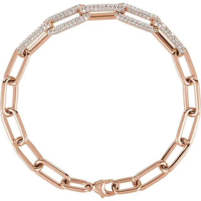 14K rose gold paperclip-style bracelet with 1.5 CTW lab-grown diamonds, shown in a circular flat lay view | JC Fine Jewelry