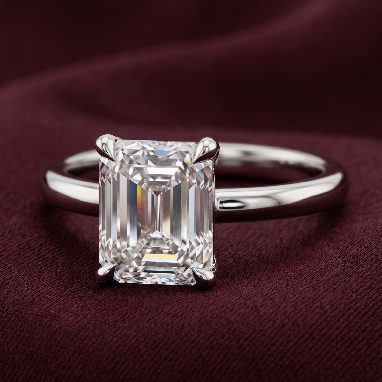 Emerald cut solitaire engagement ring in 14K white gold featuring a 2.50 CT emerald cut lab-grown diamond in E color and VVS2 clarity