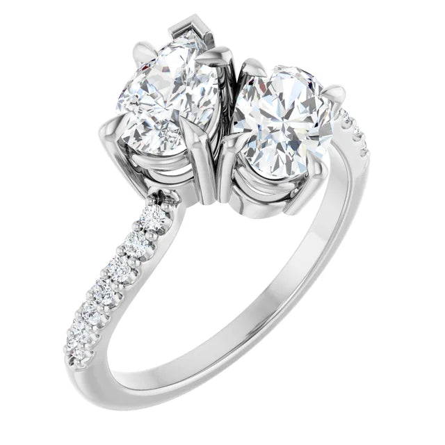Pear and oval two-stone engagement ring in 14K white gold featuring a pear-shaped and oval lab-grown diamond with pavé accents