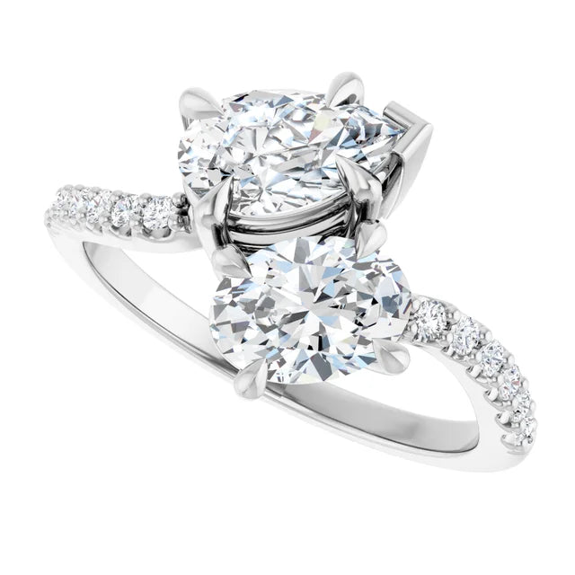 Side view of pear and oval two-stone engagement ring in 14K white gold highlighting the sparkling lab-grown diamonds and band detail