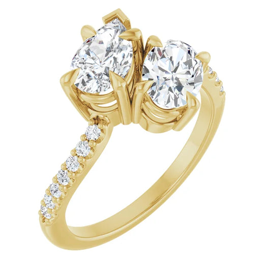 Front view of pear and oval two-stone engagement ring in 14K yellow gold showcasing the beautiful side-by-side diamond setting