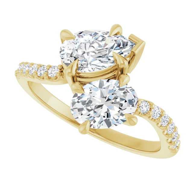 Side view of pear and oval two-stone engagement ring in 14K yellow gold with pear and oval lab-grown diamonds