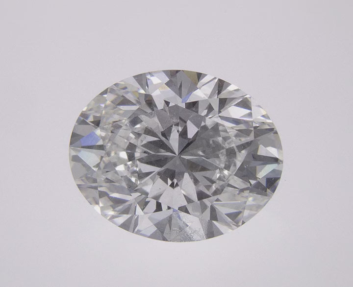 360-degree close-up video of a brilliant 1.41 CT oval lab-grown diamond. Showcasing exceptional sparkle, fire, and light performance from every angle against a clean white background.